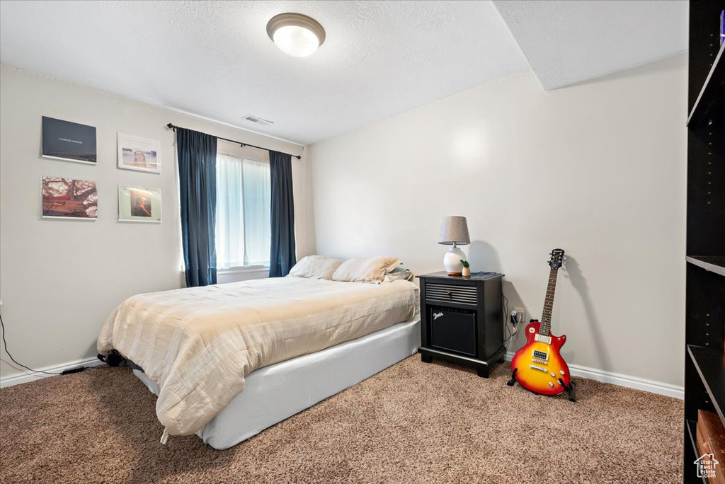 Bedroom with carpet flooring