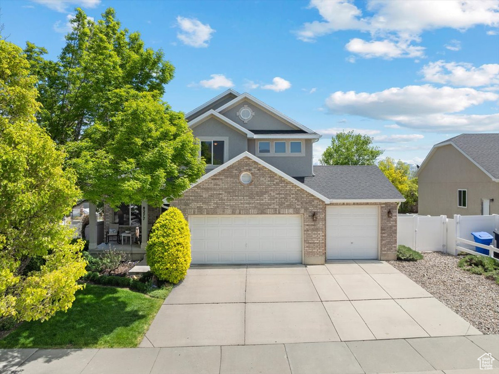 View of front of property with a garage