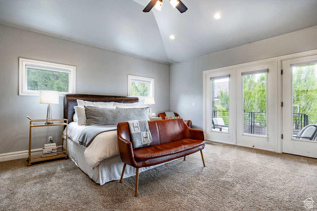 Bedroom featuring carpet, ceiling fan, access to exterior, and multiple windows