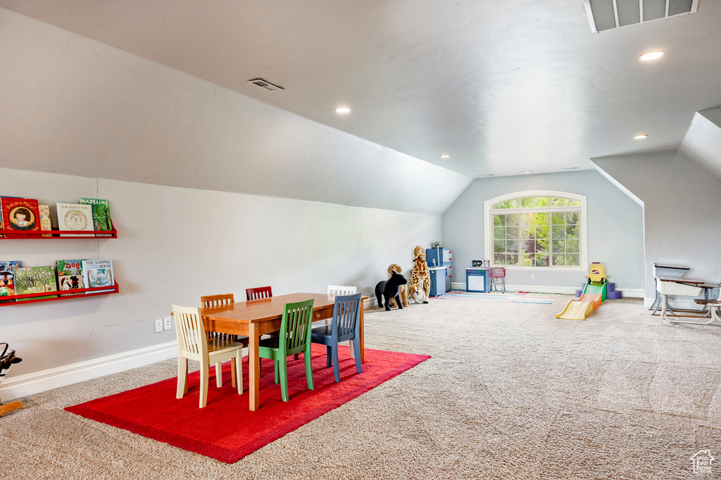 Game room featuring lofted ceiling and carpet flooring