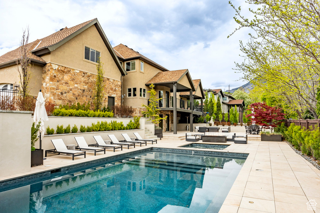 View of swimming pool with an outdoor hangout area and a patio area