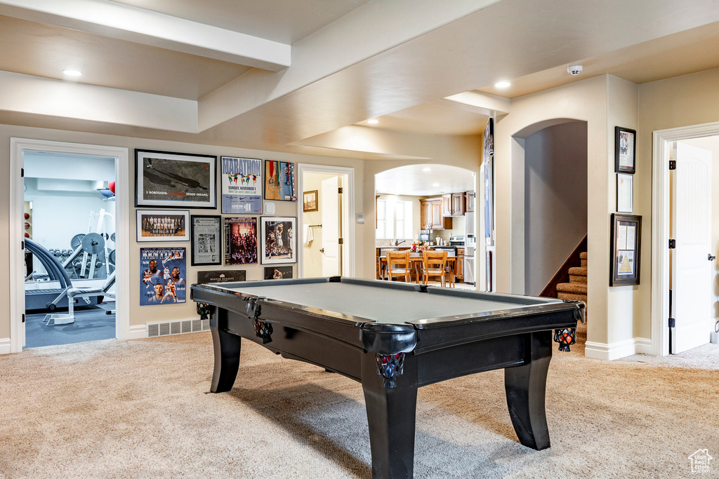 Game room with carpet flooring and pool table