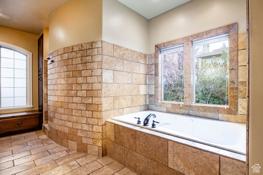 Bathroom featuring tile floors and plenty of natural light