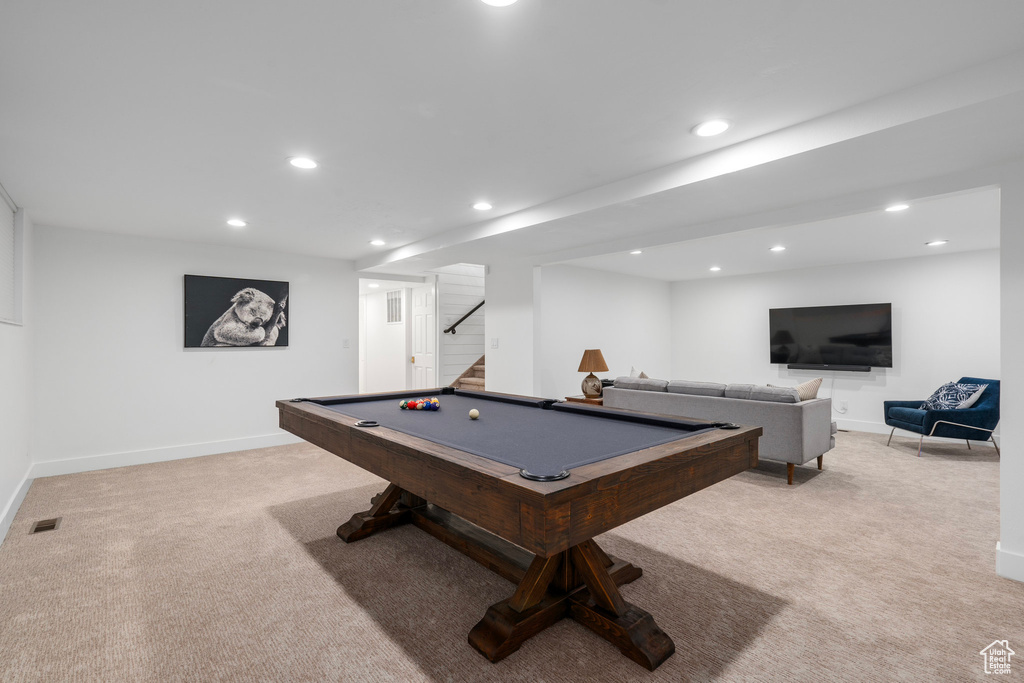 Game room with light carpet and billiards