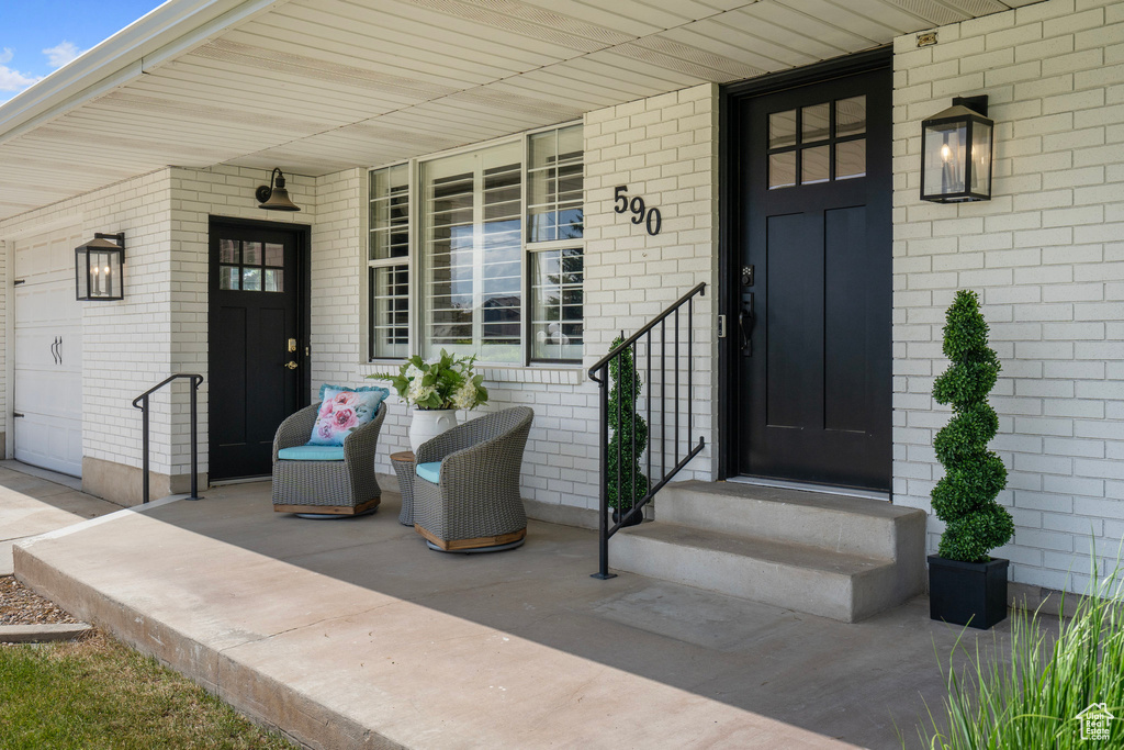 View of exterior entry featuring a porch