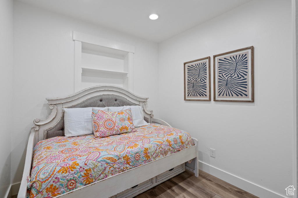 Bedroom featuring wood-type flooring