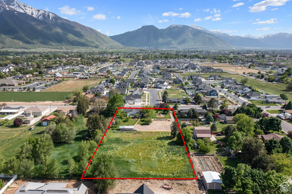 Birds eye view of property featuring a mountain view