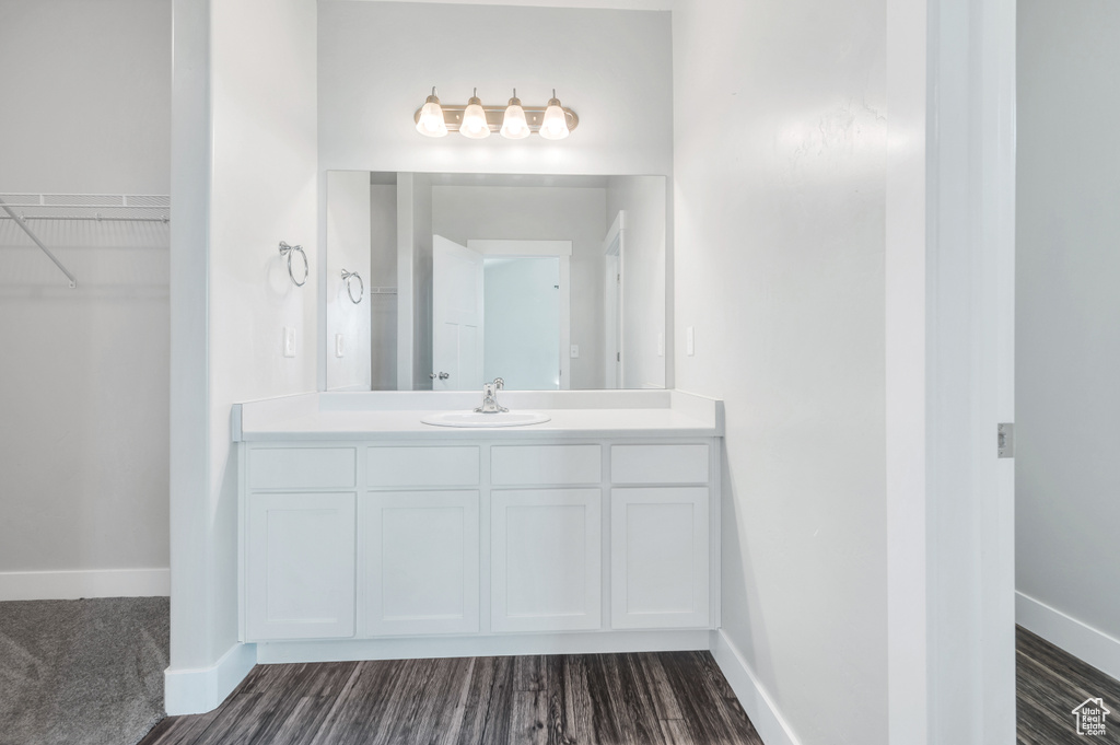 Bathroom with wood-type flooring and vanity