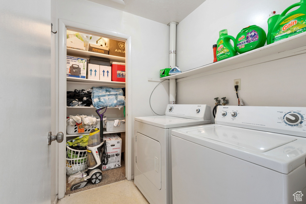Laundry room with washer hookup and washing machine and dryer