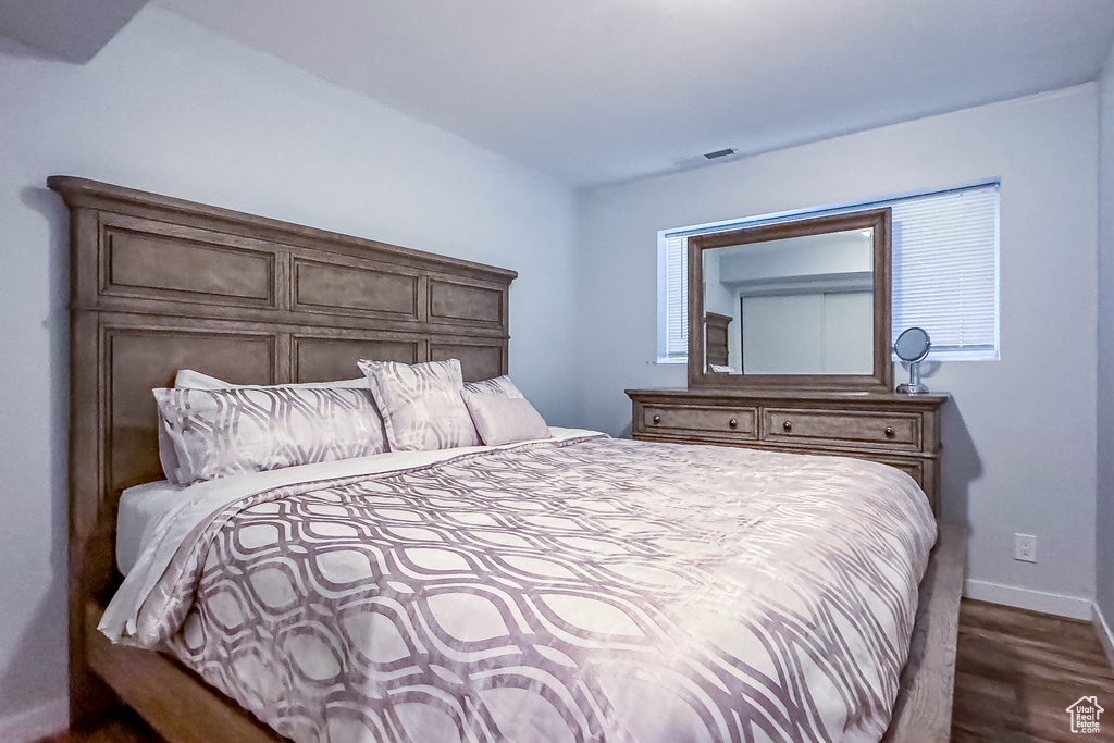 Bedroom featuring dark hardwood / wood-style flooring