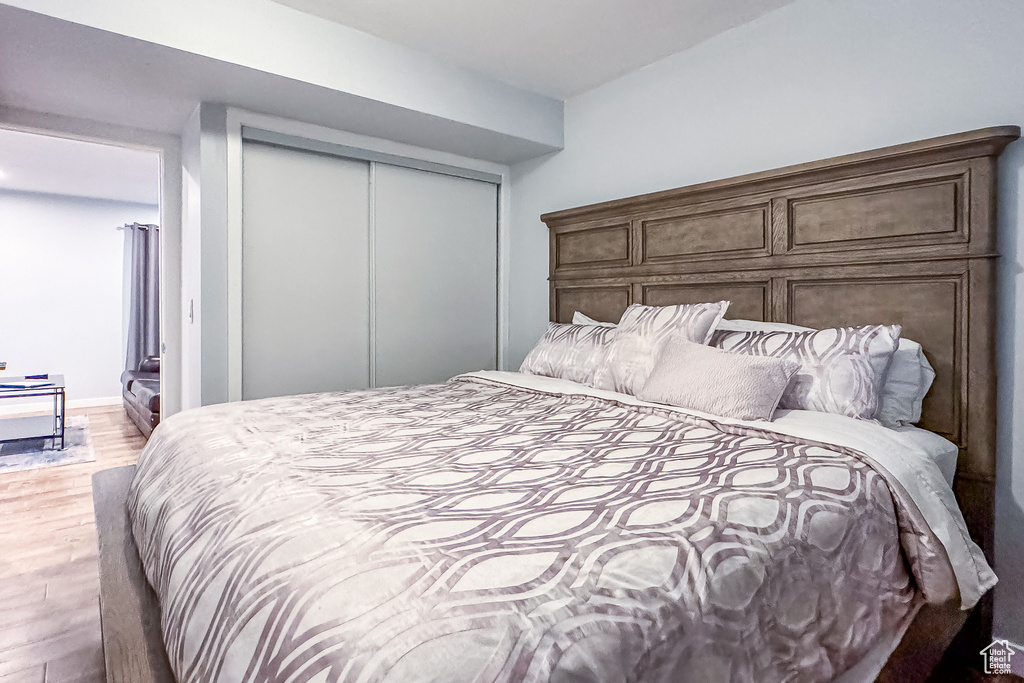 Bedroom featuring a closet and hardwood / wood-style floors