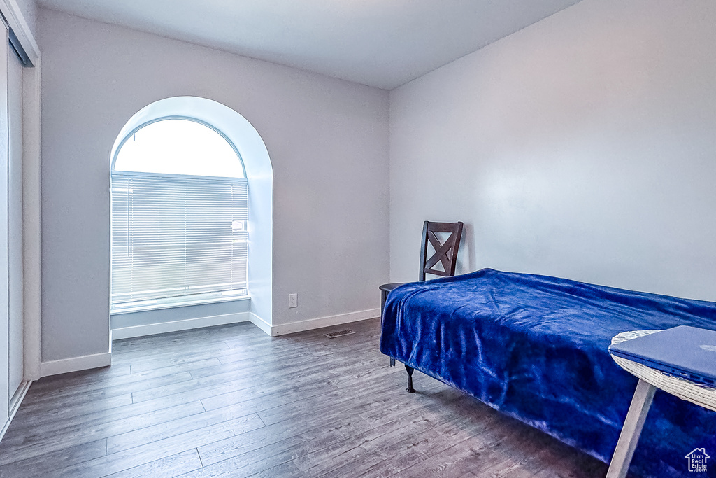 Bedroom with wood-type flooring