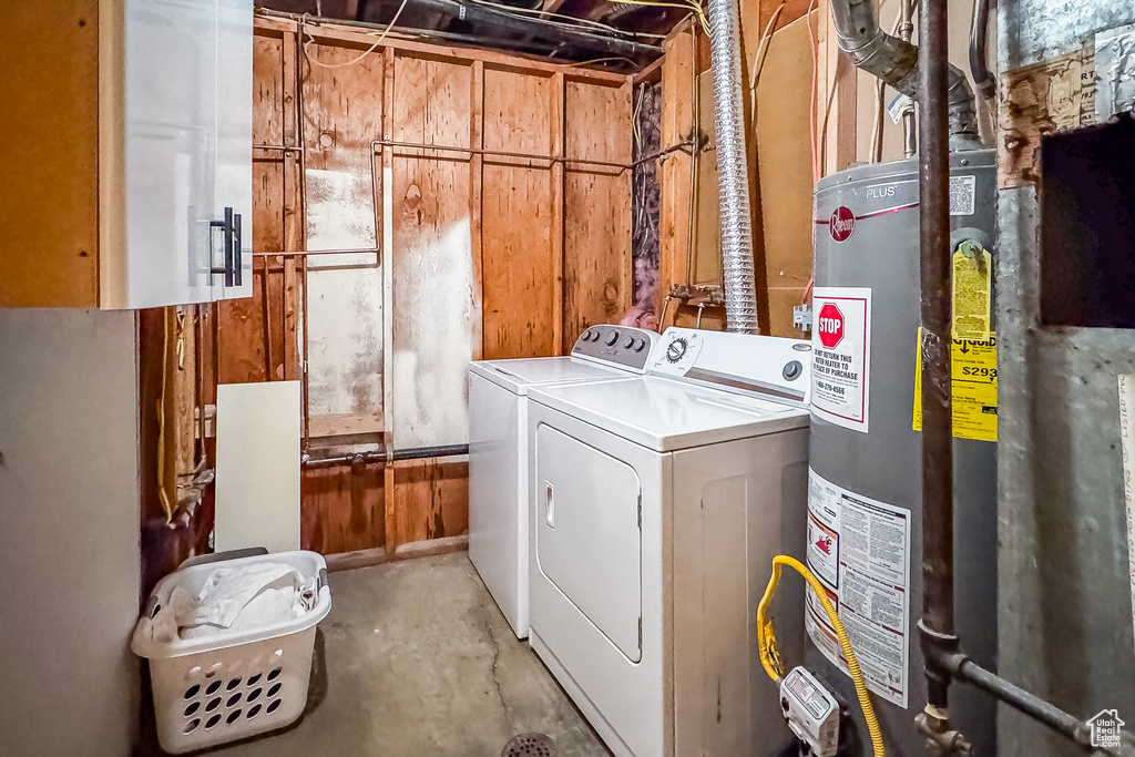 Washroom with separate washer and dryer, water heater, and hookup for a washing machine