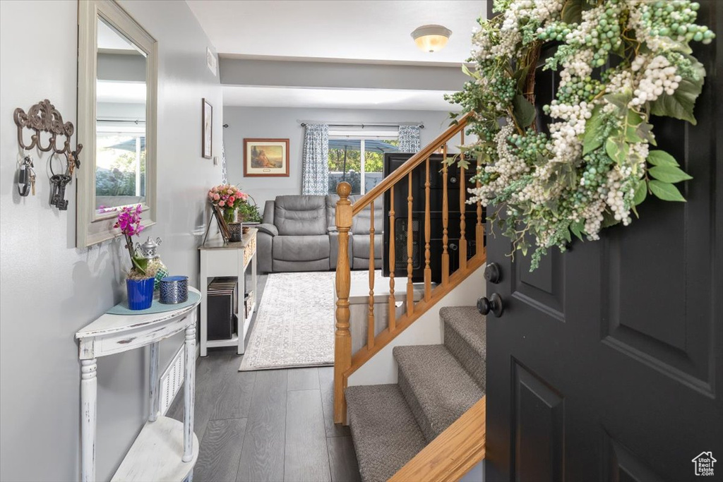 Foyer entrance with hardwood / wood-style floors