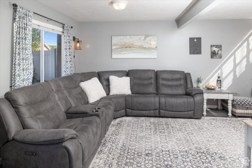 Living room featuring beamed ceiling