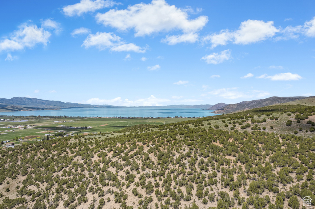 View of mountain backdrop featuring a nearby body of water