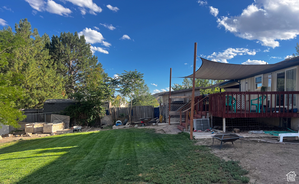 View of yard with a deck