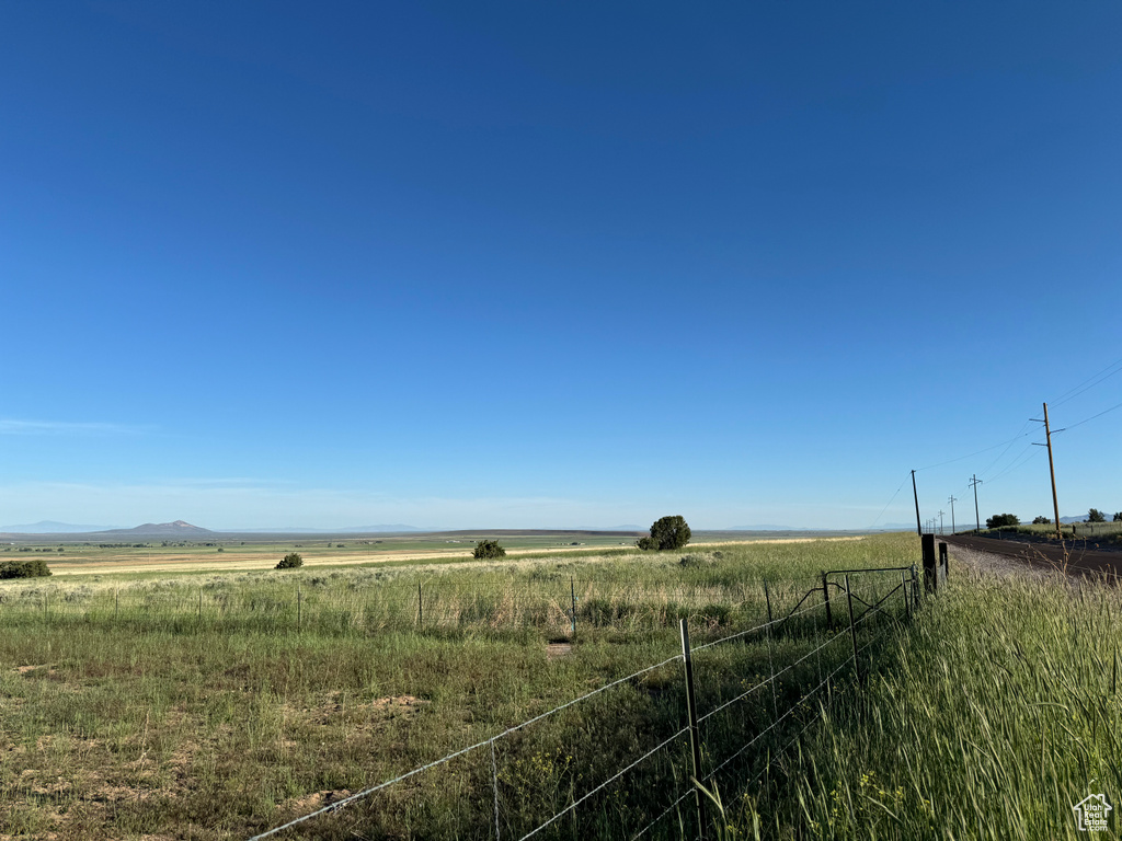 View of yard with a rural view