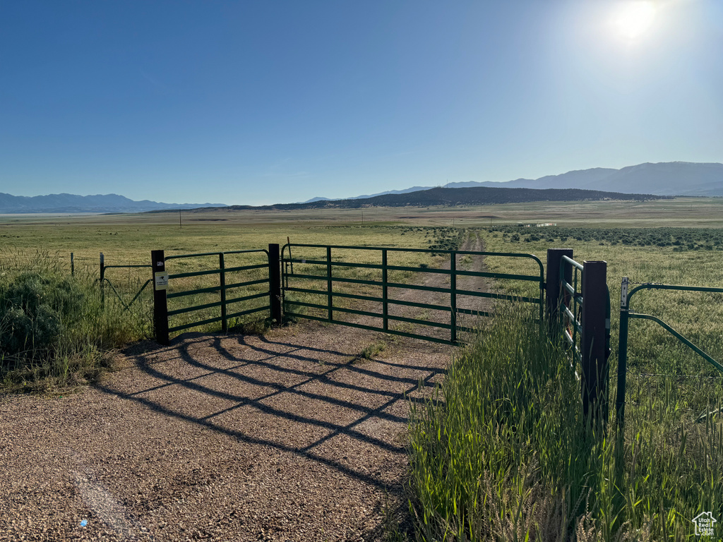 View of gate featuring a mountain view and a rural view