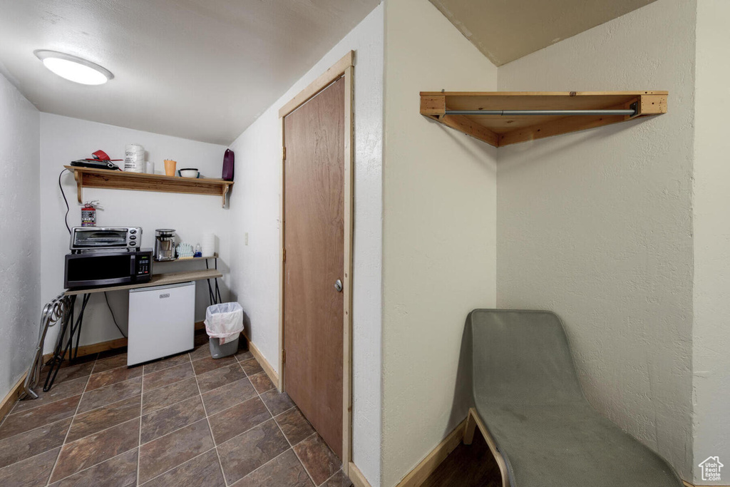 Interior space with dark tile floors