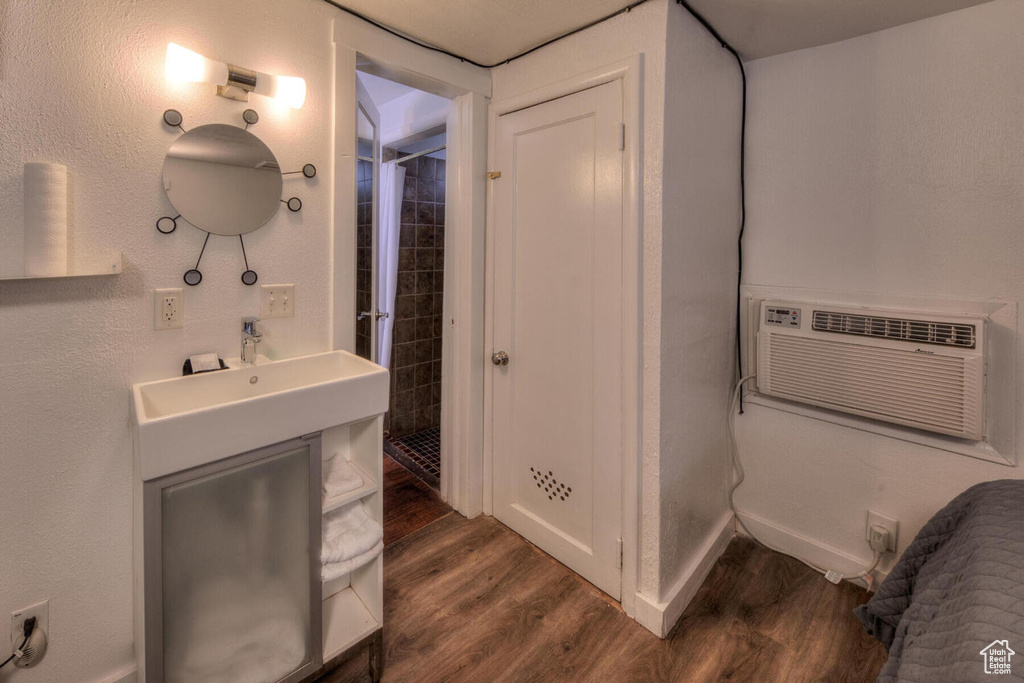 Bathroom with wood-type flooring and vanity