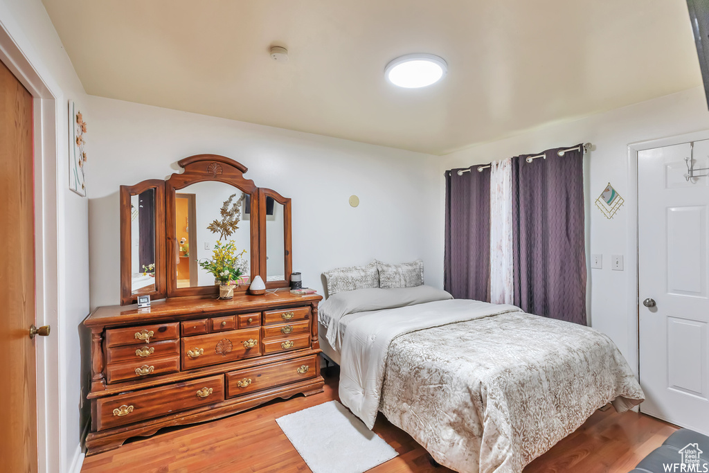 Bedroom featuring wood-type flooring