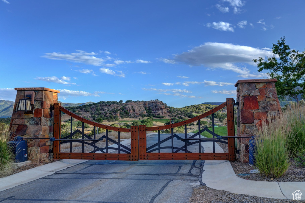 View of gate featuring a mountain view