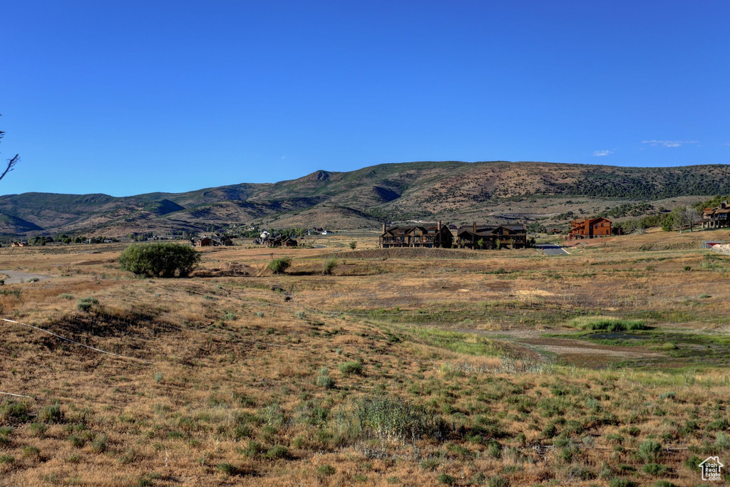 Property view of mountains with a rural view