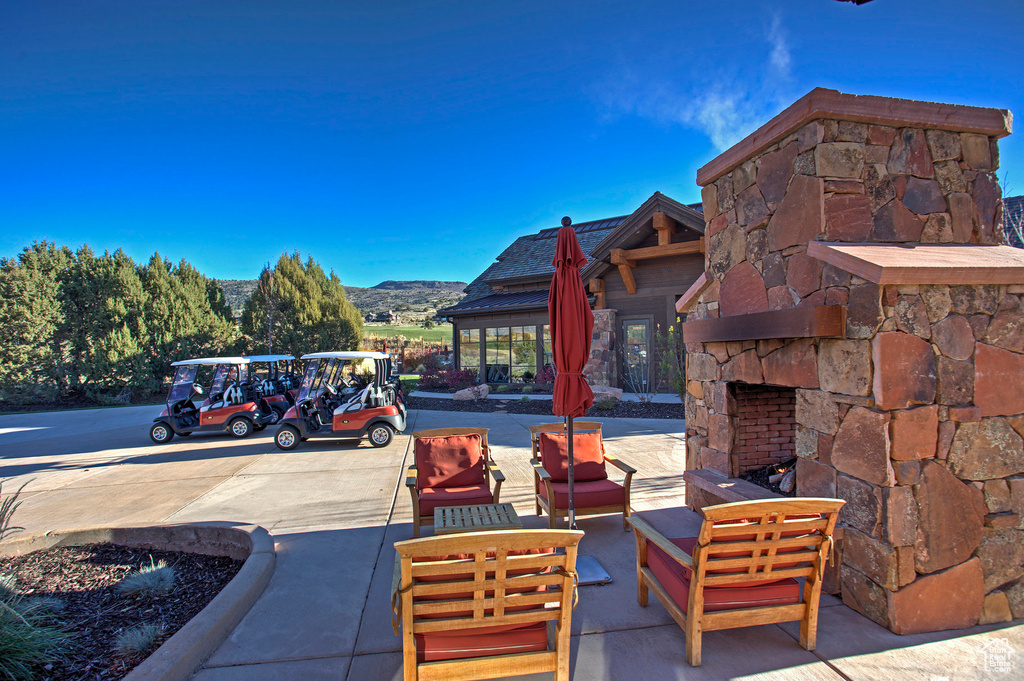 View of patio / terrace featuring an outdoor living space with a fireplace