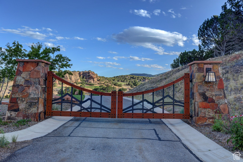 View of gate featuring a mountain view