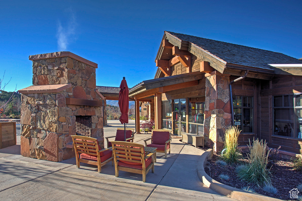 View of patio / terrace featuring an outdoor living space with a fireplace