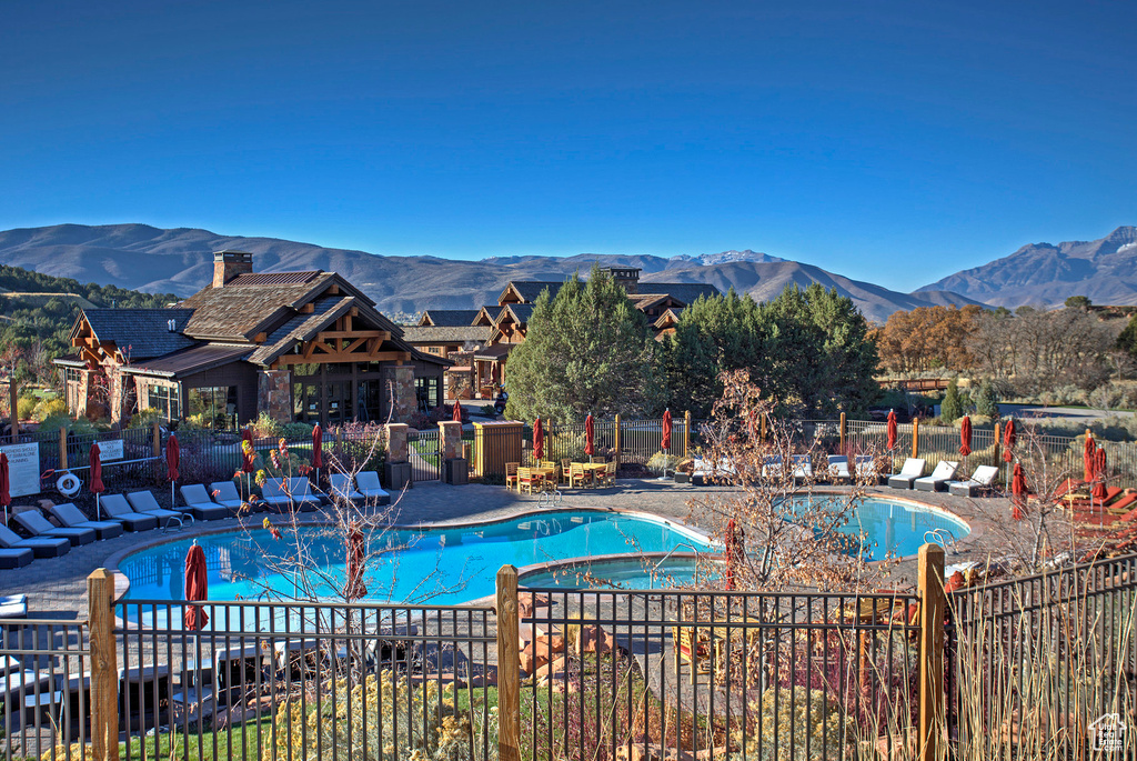 View of pool featuring a patio and a mountain view