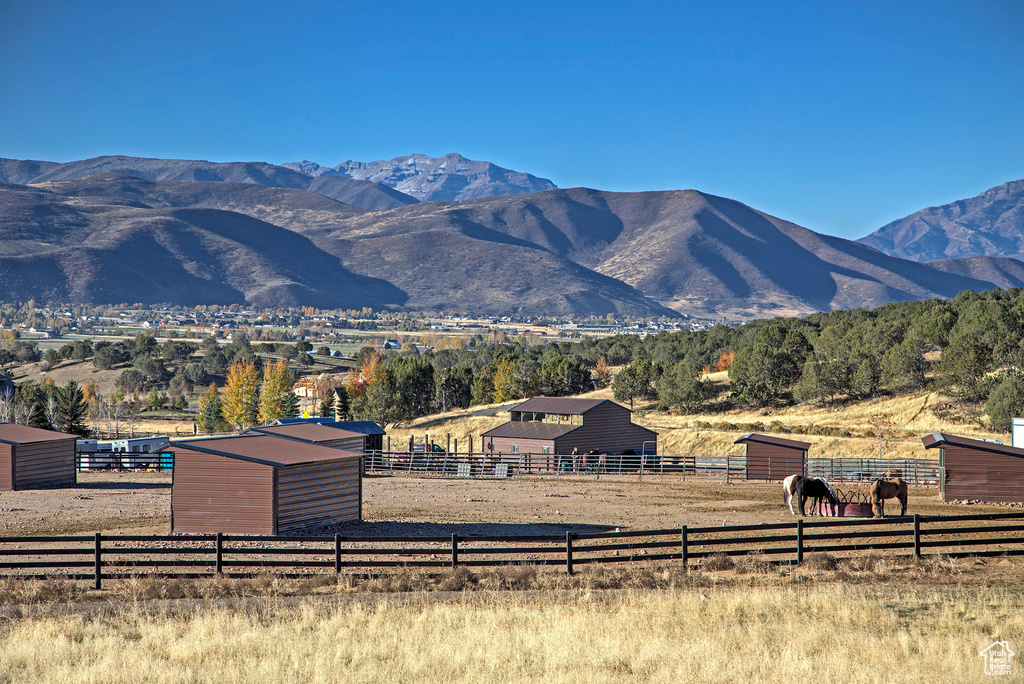 Property view of mountains with a rural view