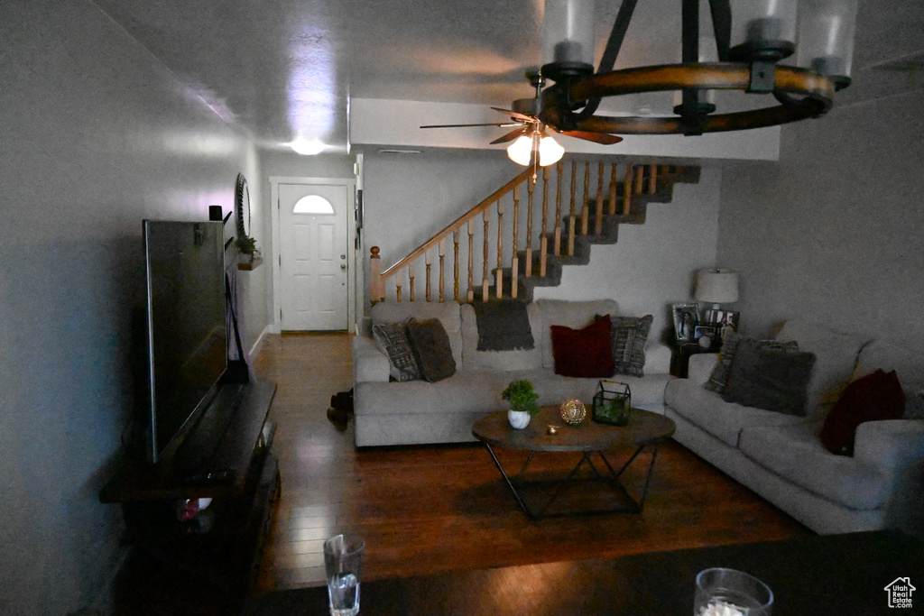 Living room featuring hardwood / wood-style floors and ceiling fan