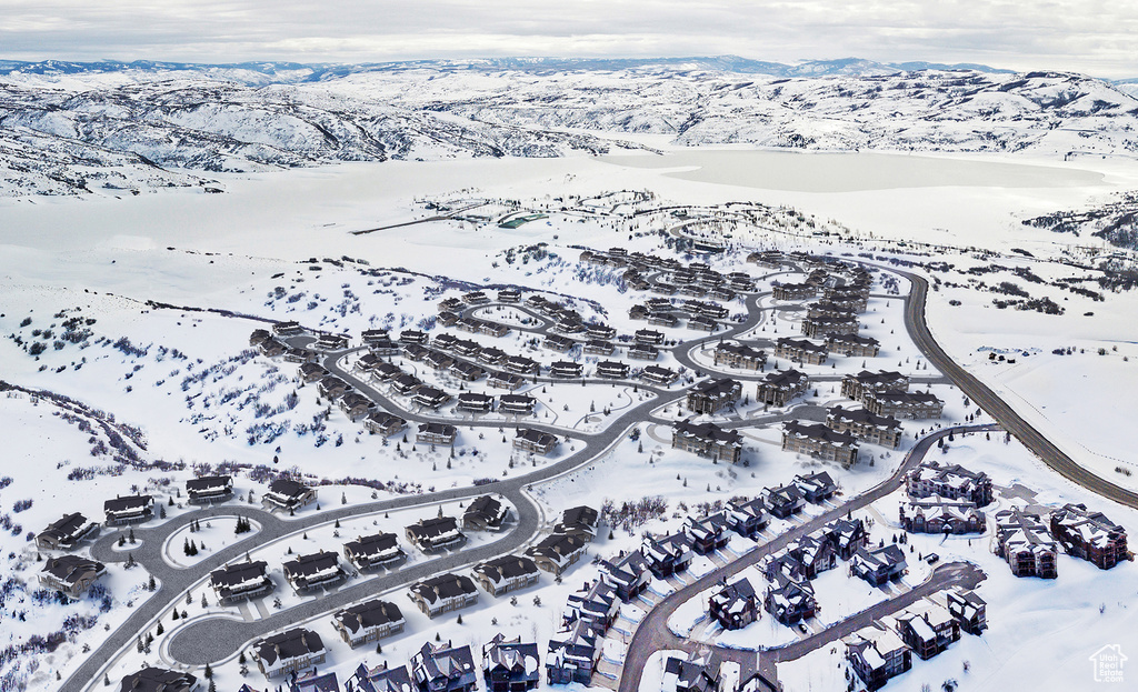 Snowy aerial view with a mountain view