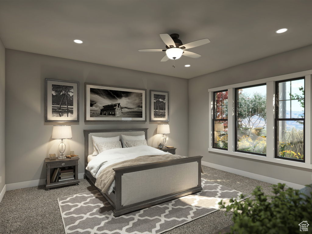 Carpeted bedroom featuring ceiling fan