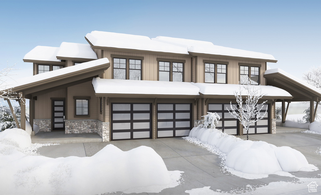 View of front facade featuring a garage