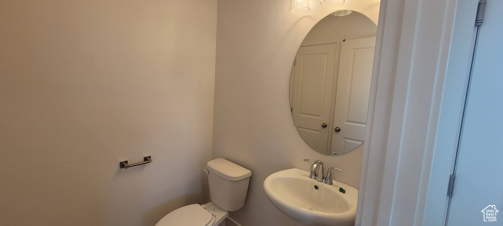 Bathroom with sink and toilet