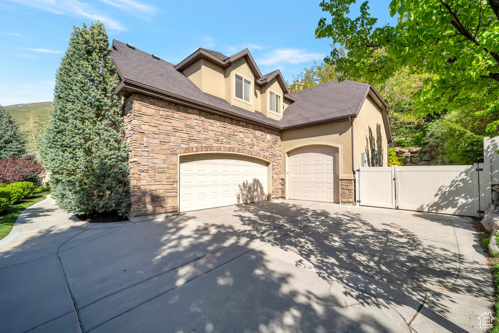 View of property exterior with a garage