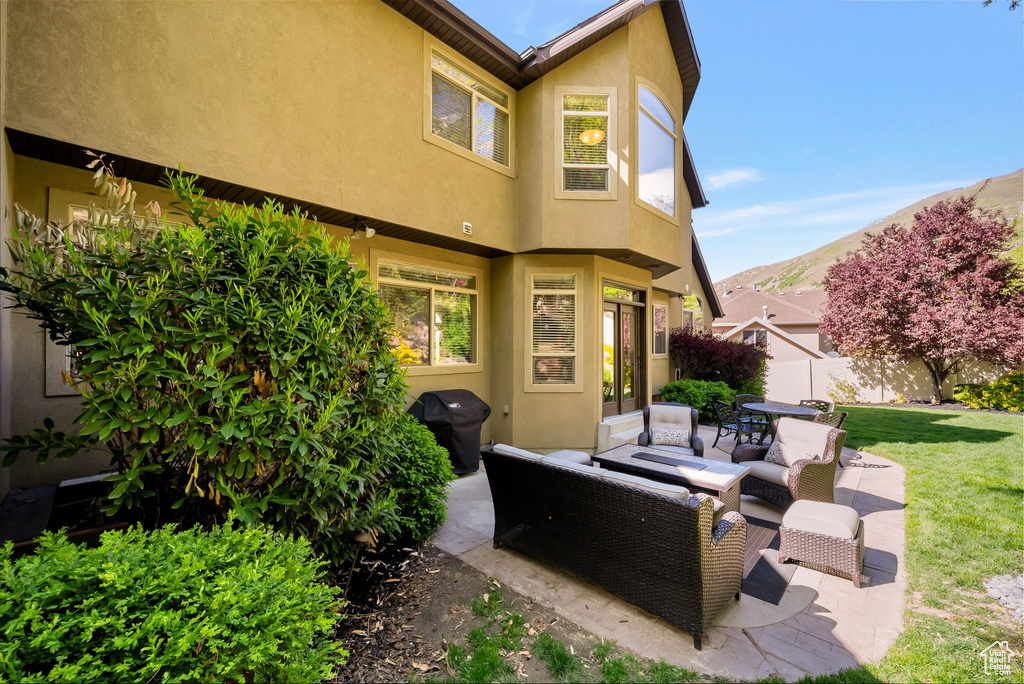 View of patio / terrace with a grill and an outdoor living space