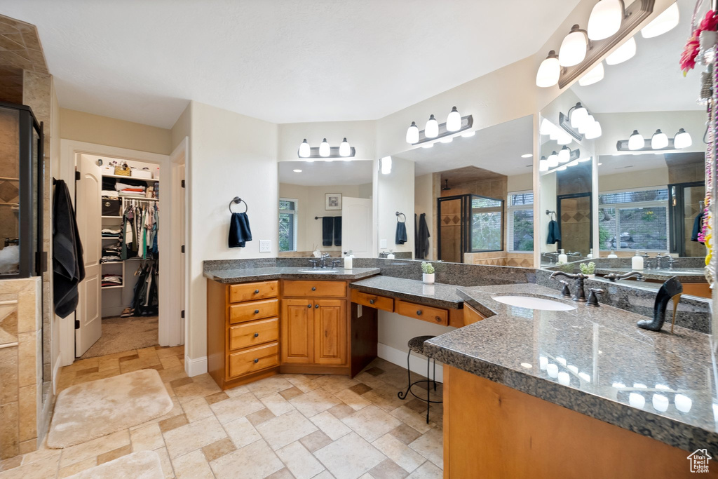 Bathroom with tile flooring and vanity