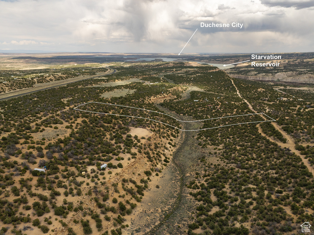 Birds eye view of property with a rural view