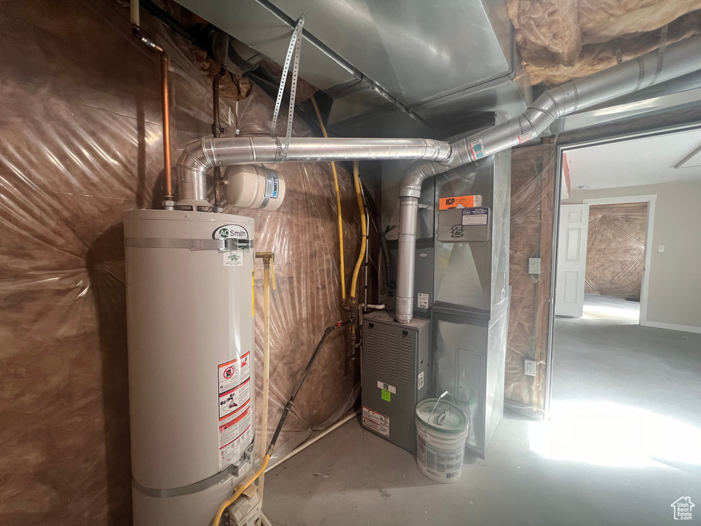 Utility room with strapped water heater