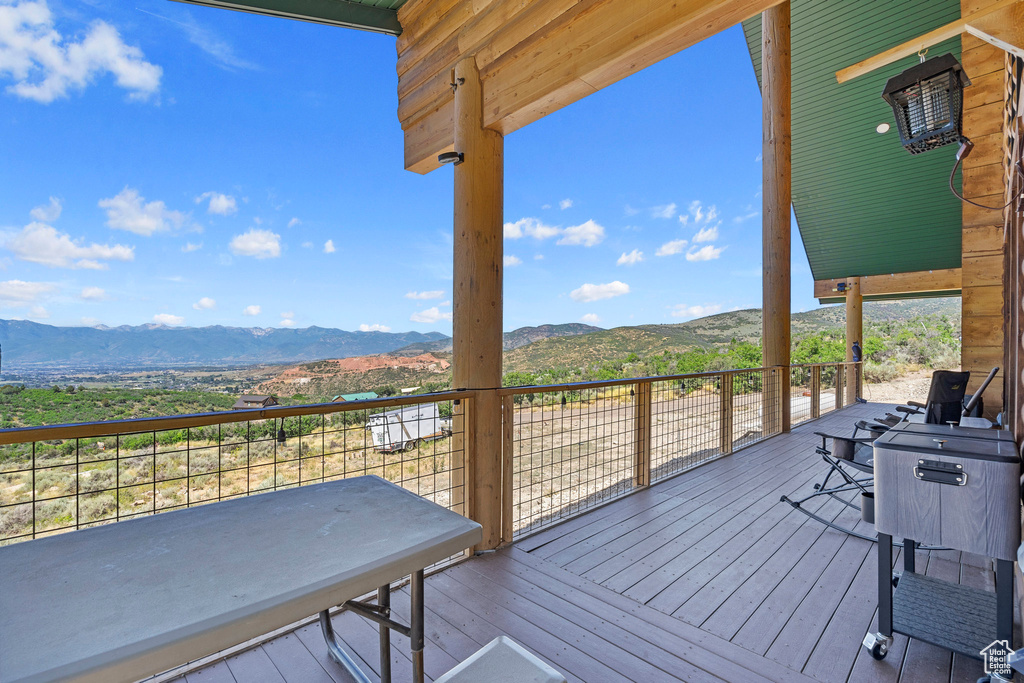 Wooden deck featuring a mountain view