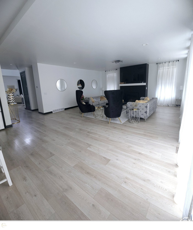 Unfurnished living room featuring light wood-type flooring