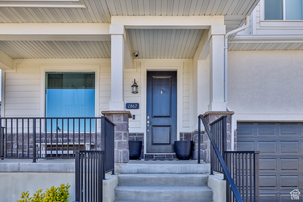 Property entrance with a garage