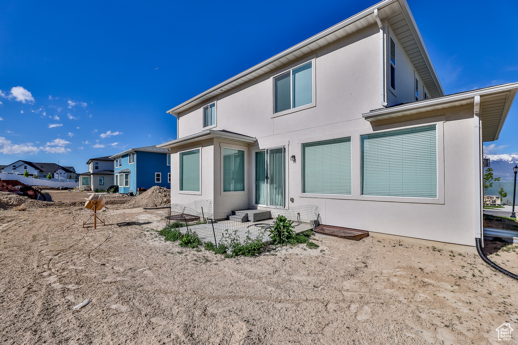 Rear view of house with a patio area