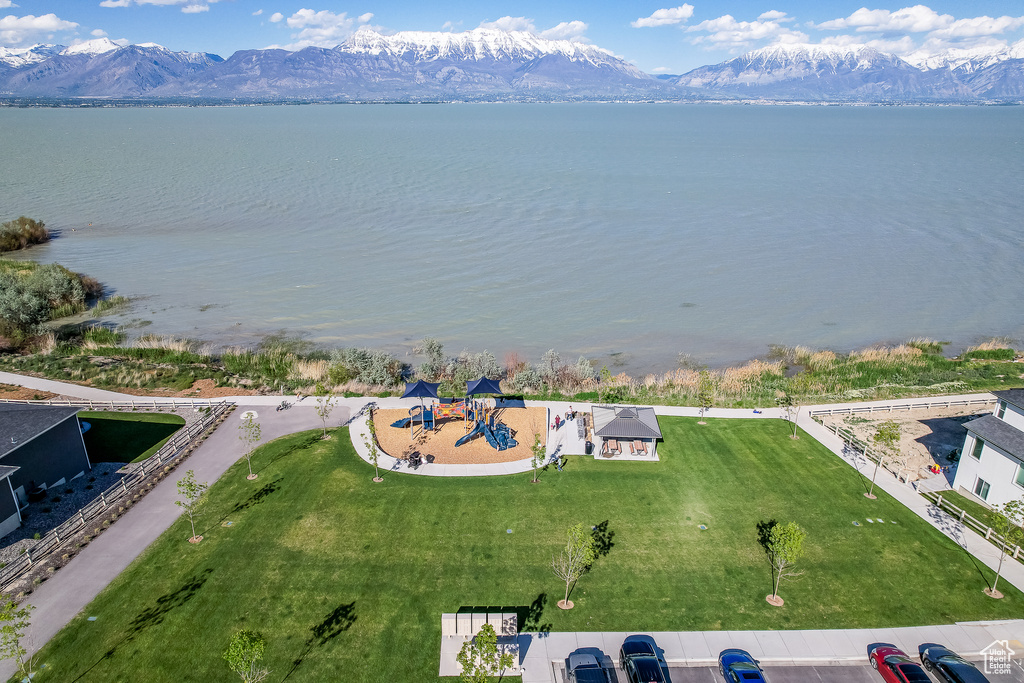 Drone / aerial view with a water and mountain view