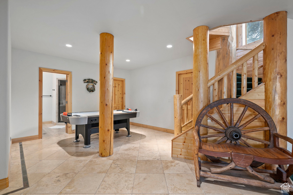 Interior space featuring light tile floors