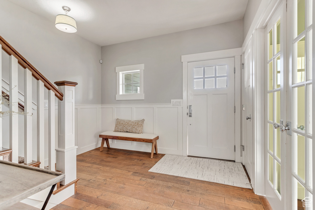 Entryway with light hardwood / wood-style flooring and french doors